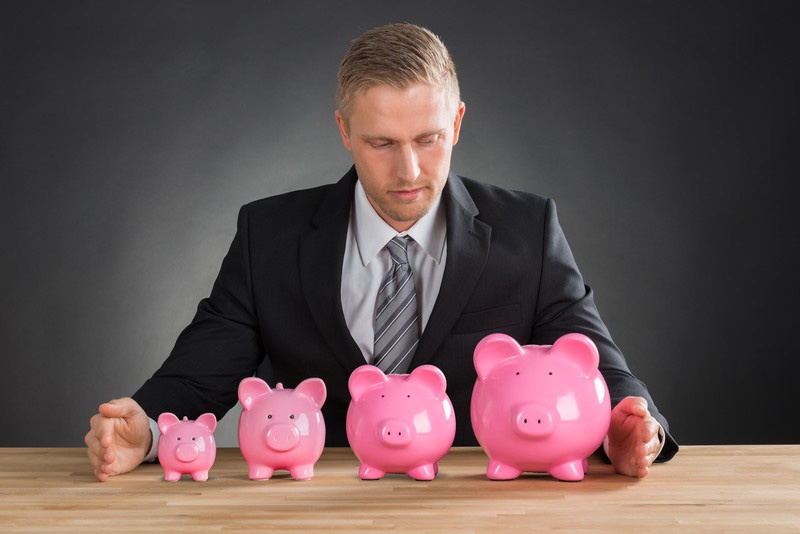 Man with Multiple Piggy Banks